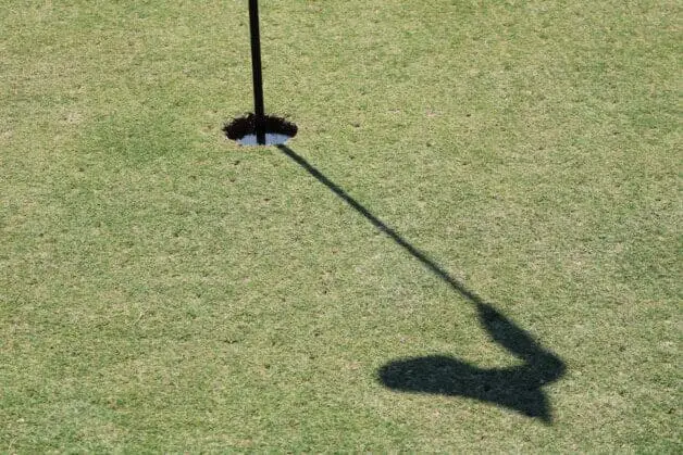 how close should i stand to the golf ball